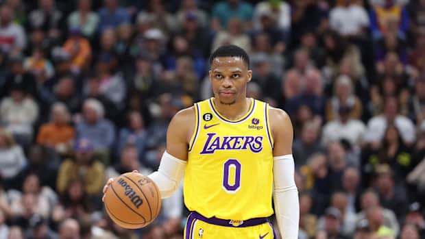 Russell Westbrook dribbles the ball.